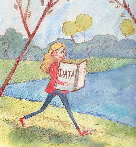 A woman walking in a park holding a box that says "data" on it.
