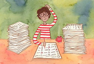 A man with striped shirt and glasses with piles of papers on each side marking up a test.